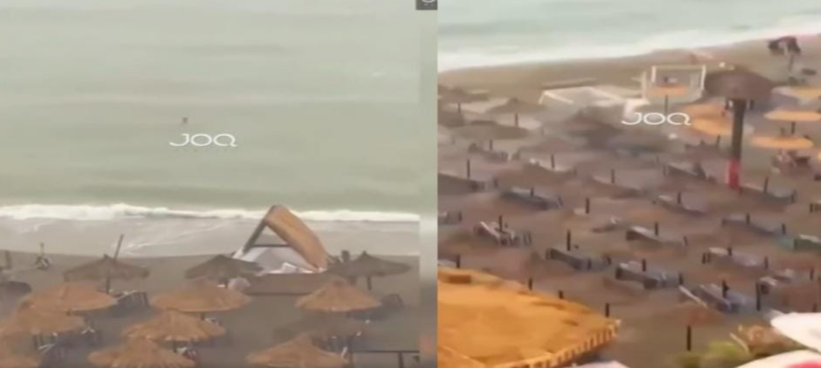 ВИДЕО: Силно невреме го зафати Драч, сламени чадори паднаа и „заробија“ човек